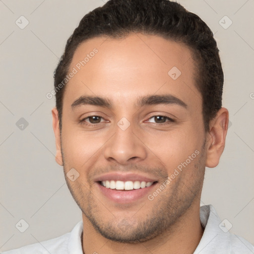 Joyful white young-adult male with short  brown hair and brown eyes