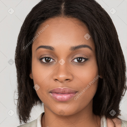 Joyful black young-adult female with long  brown hair and brown eyes