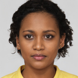 Neutral black young-adult female with short  black hair and brown eyes