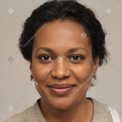 Joyful black adult female with short  brown hair and brown eyes