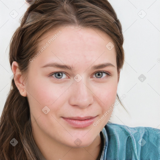 Joyful white young-adult female with long  brown hair and blue eyes