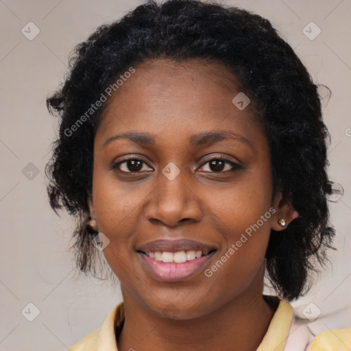 Joyful black young-adult female with medium  black hair and brown eyes