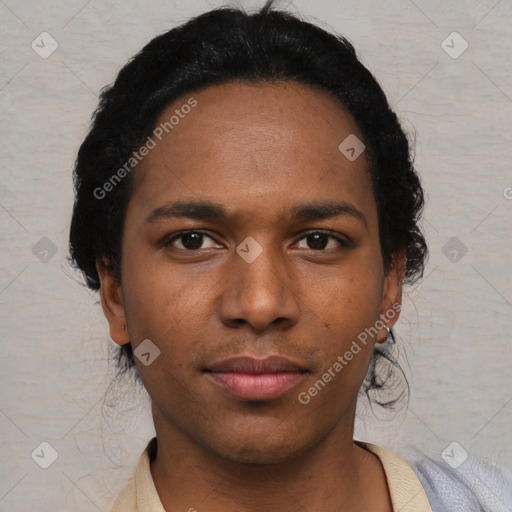 Joyful black young-adult male with short  black hair and brown eyes