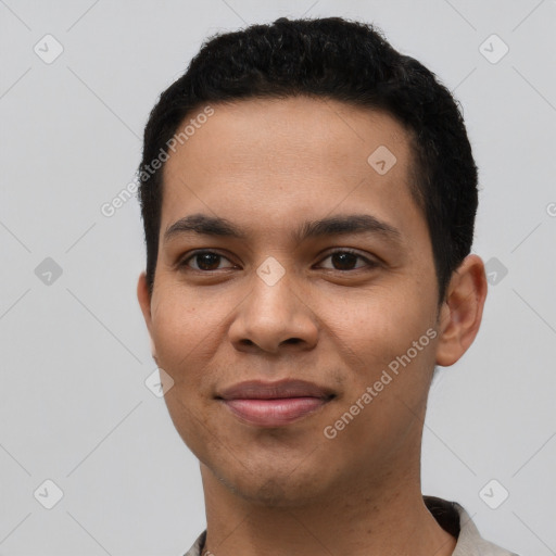 Joyful latino young-adult male with short  black hair and brown eyes