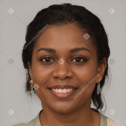 Joyful black young-adult female with medium  brown hair and brown eyes