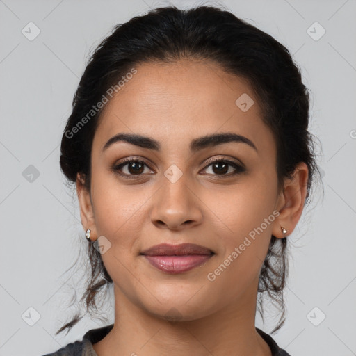 Joyful latino young-adult female with medium  brown hair and brown eyes