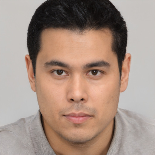 Neutral latino young-adult male with short  brown hair and brown eyes