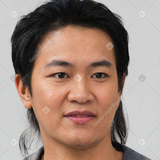 Joyful asian adult male with short  black hair and brown eyes