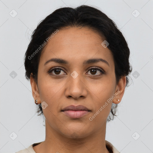 Joyful latino young-adult female with short  brown hair and brown eyes