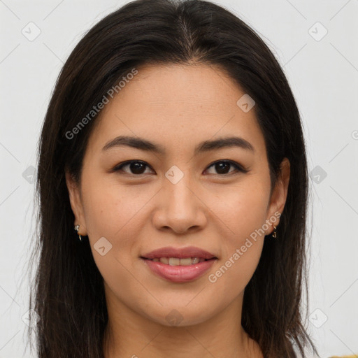 Joyful latino young-adult female with long  brown hair and brown eyes