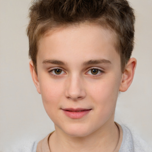 Joyful white child male with short  brown hair and brown eyes