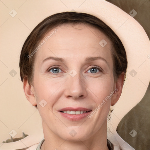 Joyful white adult female with short  brown hair and grey eyes