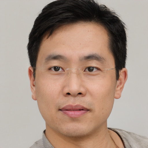 Neutral asian young-adult male with short  black hair and brown eyes