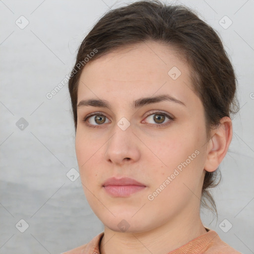 Neutral white young-adult female with short  brown hair and brown eyes