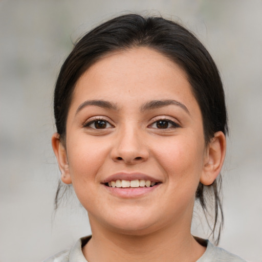 Joyful white young-adult female with medium  brown hair and brown eyes