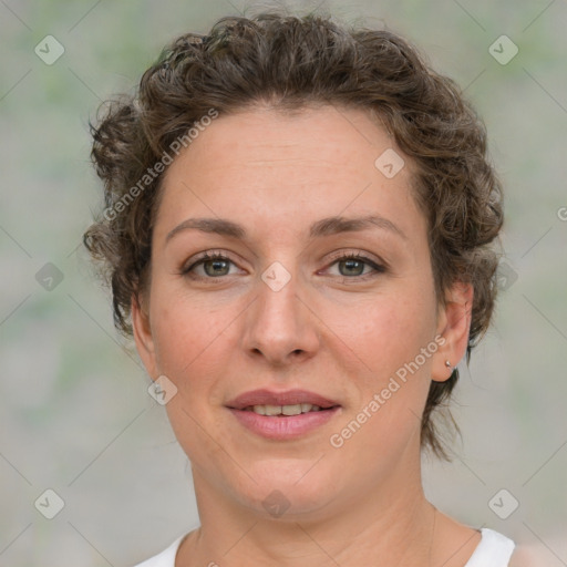 Joyful white young-adult female with medium  brown hair and green eyes