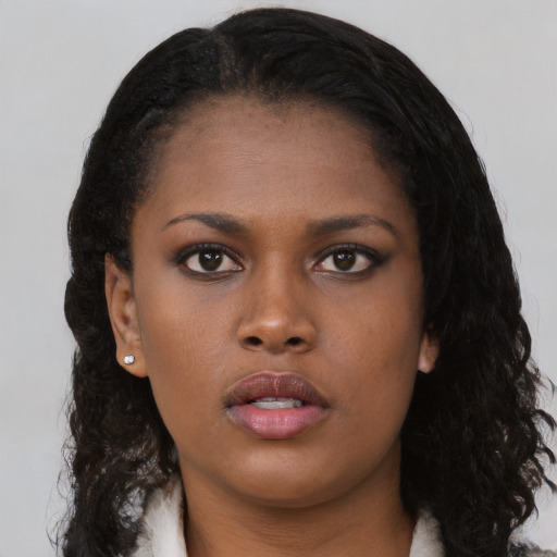 Neutral black young-adult female with long  black hair and brown eyes