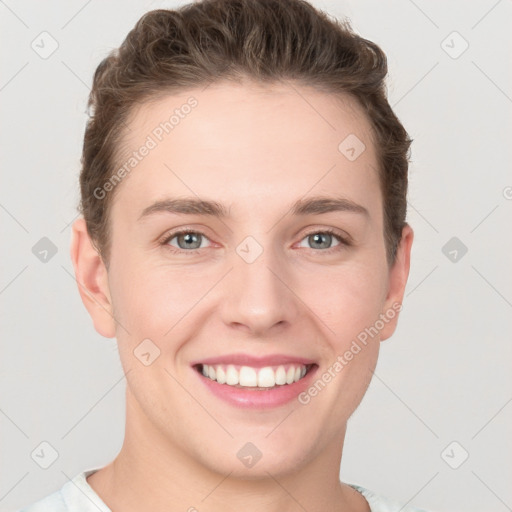 Joyful white young-adult female with short  brown hair and grey eyes