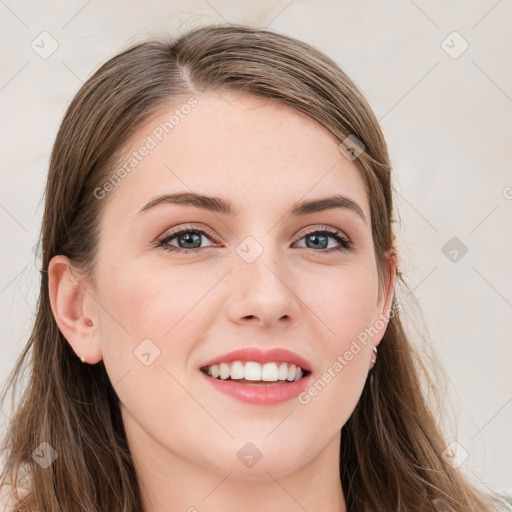 Joyful white young-adult female with long  brown hair and blue eyes