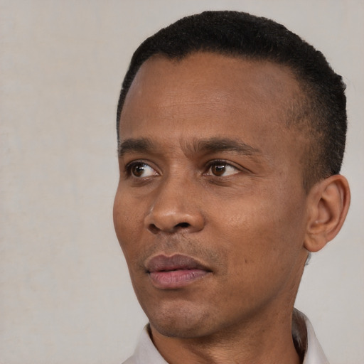Neutral black adult male with short  black hair and brown eyes