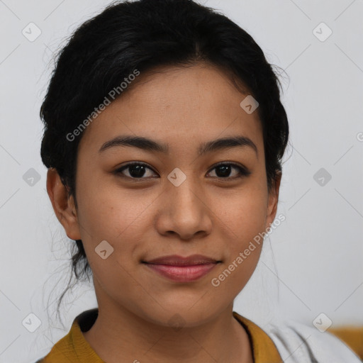 Joyful latino young-adult female with short  brown hair and brown eyes