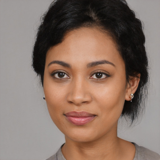 Joyful latino young-adult female with medium  black hair and brown eyes