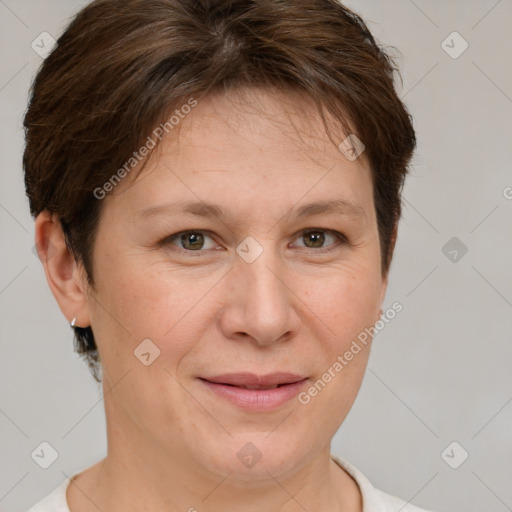 Joyful white adult female with short  brown hair and grey eyes