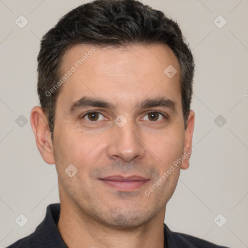 Joyful white adult male with short  brown hair and brown eyes