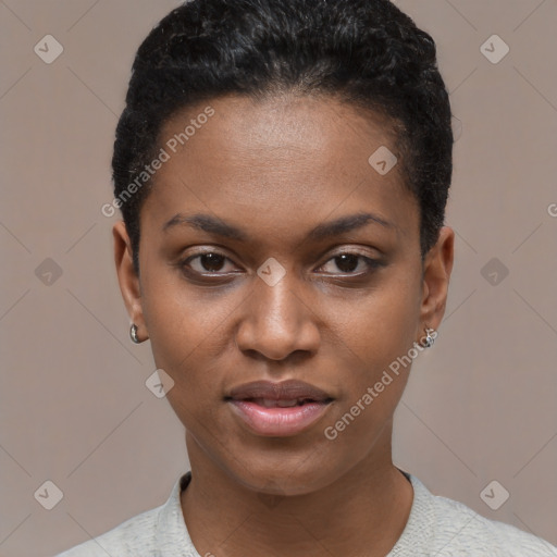 Joyful black young-adult female with short  black hair and brown eyes