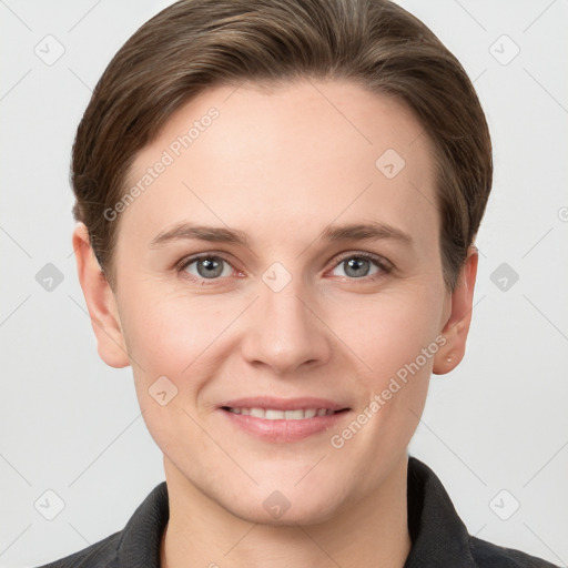 Joyful white young-adult female with short  brown hair and grey eyes