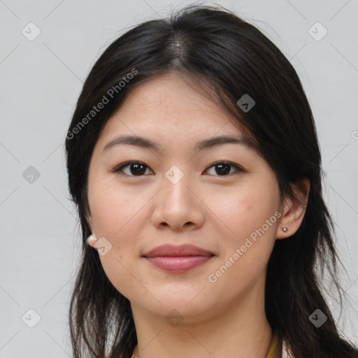 Joyful asian young-adult female with long  brown hair and brown eyes