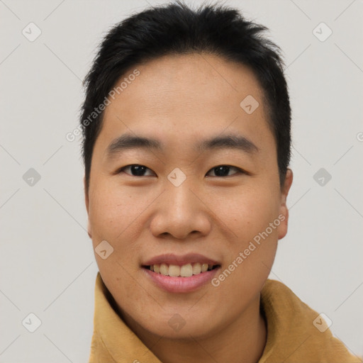 Joyful asian young-adult male with short  brown hair and brown eyes