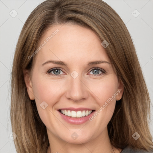 Joyful white adult female with medium  brown hair and grey eyes