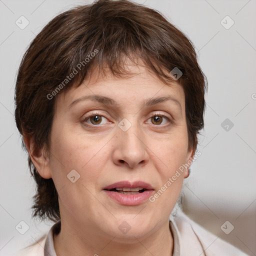 Joyful white adult female with medium  brown hair and brown eyes