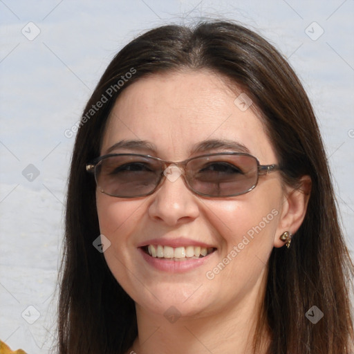 Joyful white adult female with long  brown hair and brown eyes