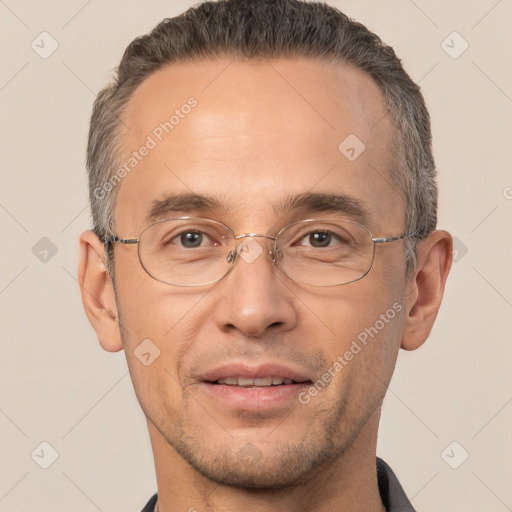 Joyful white adult male with short  brown hair and brown eyes