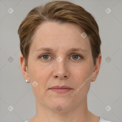 Joyful white adult female with short  brown hair and grey eyes