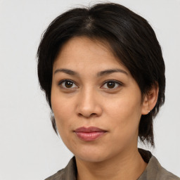 Joyful white young-adult female with medium  brown hair and brown eyes