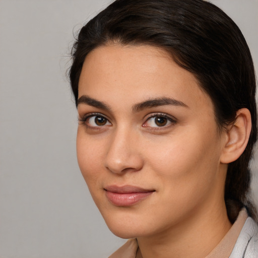 Joyful white young-adult female with medium  brown hair and brown eyes