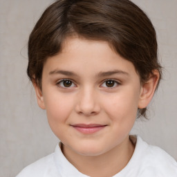 Joyful white child female with medium  brown hair and brown eyes