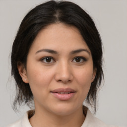 Joyful white young-adult female with medium  brown hair and brown eyes