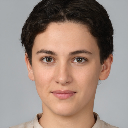 Joyful white young-adult female with short  brown hair and brown eyes