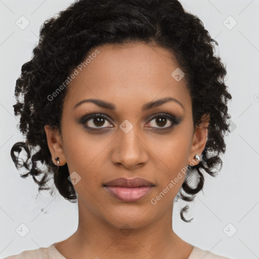 Joyful black young-adult female with medium  brown hair and brown eyes