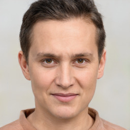 Joyful white adult male with short  brown hair and brown eyes