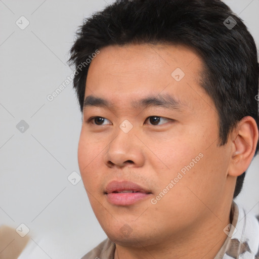 Neutral asian young-adult male with short  black hair and brown eyes
