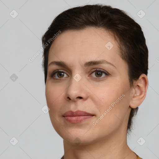 Joyful white young-adult female with short  brown hair and brown eyes