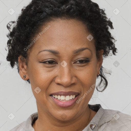 Joyful black adult female with short  brown hair and brown eyes