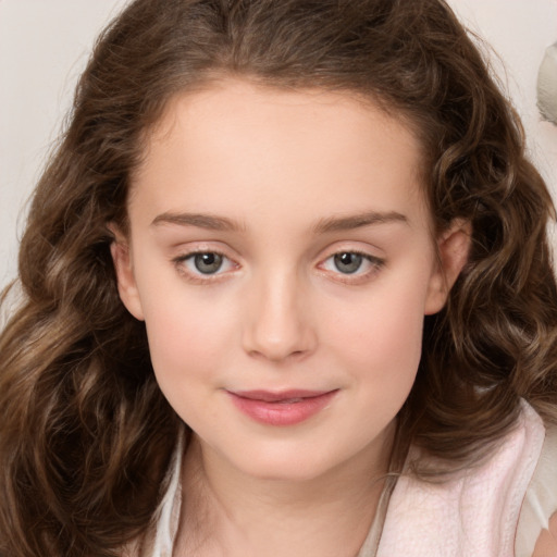 Joyful white child female with long  brown hair and brown eyes