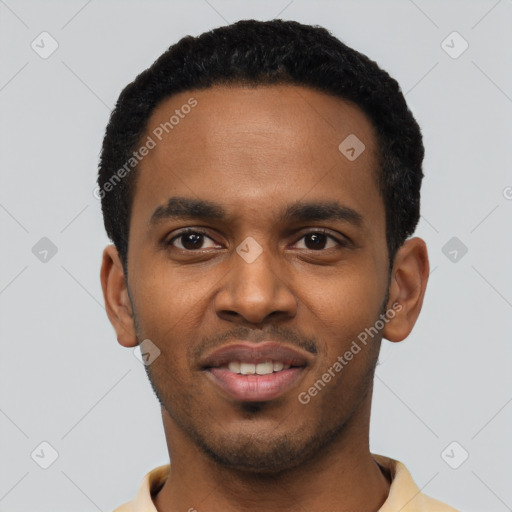 Joyful black young-adult male with short  black hair and brown eyes