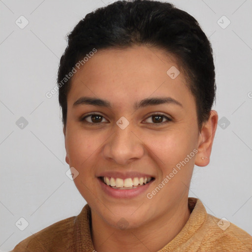 Joyful latino young-adult female with short  brown hair and brown eyes